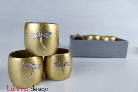 Set of 6 gold napkin rings attached with dragonfly